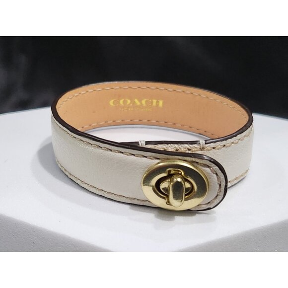 Coach Jewelry - Coach Turnlock White Leather and Gold-tone Cuff Bracelet
